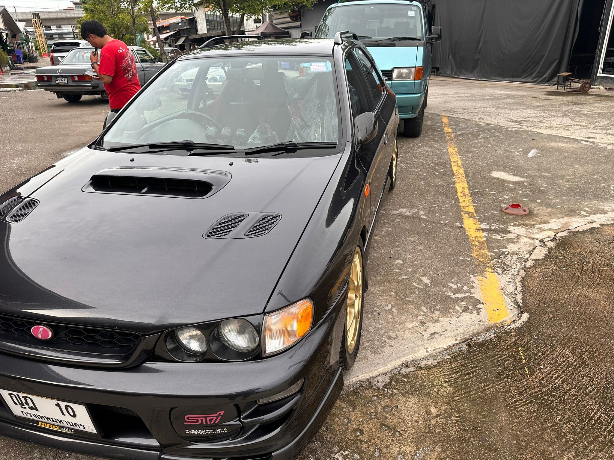 https://storage.googleapis.com/static_assets_iconicimports/dev_static/images/car_catalog/black_sti_3.jpg